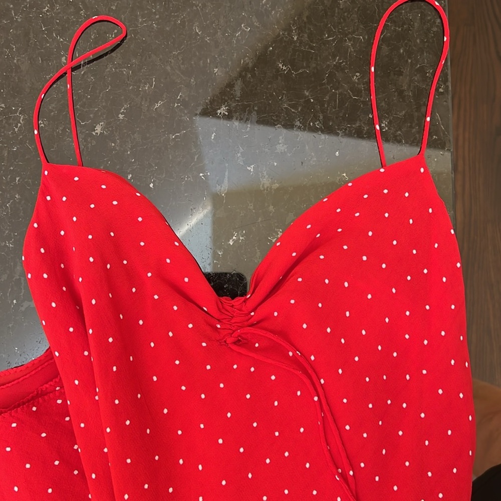 Red dress with white polka dots.